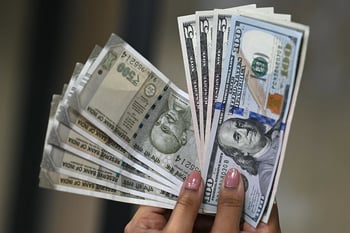 Rupee slides to record low, 100 per dollar in sight?