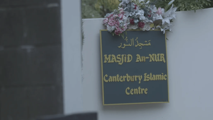 Flowers left at Masjid Annur on the first anniversary in 2020. Photo: RNZ / Logan Church