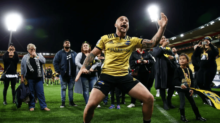 TJ Perenara of the Hurricanes responds to a haka from supporters in recognition of his 100th game. Photo: Hagen Hopkins