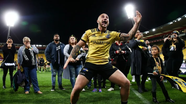 TJ Perenara of the Hurricanes responds to a haka from supporters in recognition of his 100th game. Photo: Hagen Hopkins
