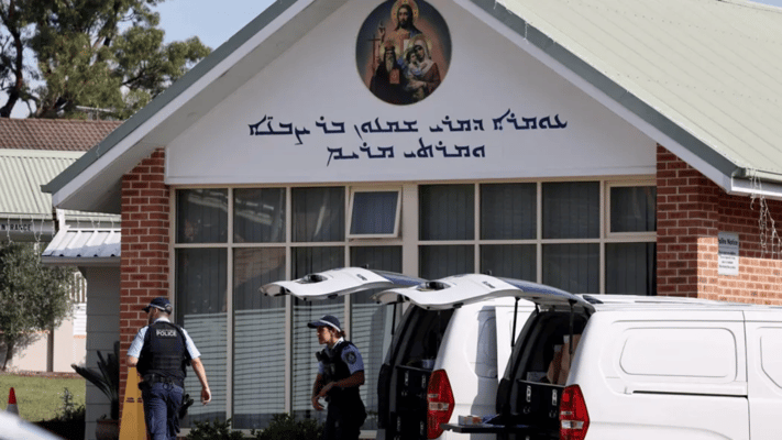 Police officers and their vehicles can be seen outside the Christ the Good Shepherd Church in Sydney's western suburb of Wakeley on 16 April 16, 2024