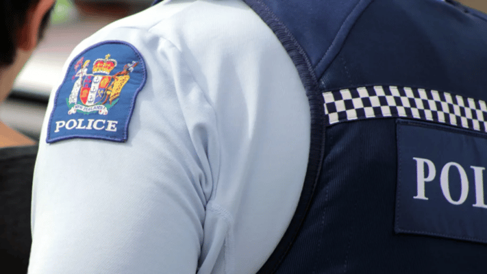 A man is in custody after a night of turmoil in the eastern Bay of Plenty, where police officers were fired upon and residents were held hostage in their homes overnight.