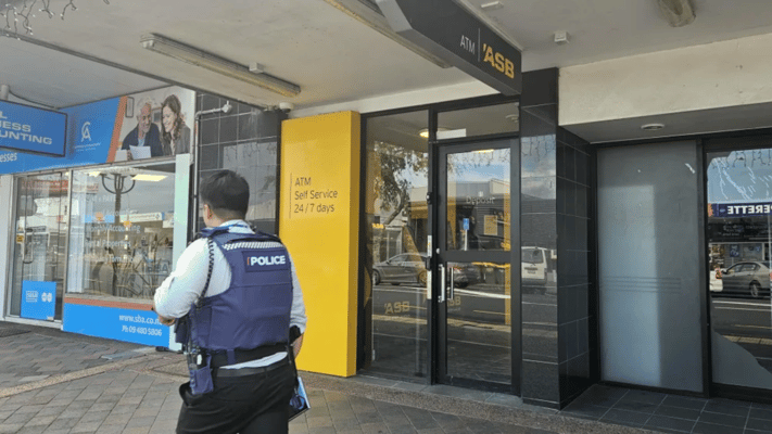 A hunt is underway for a man who stole cash from security guards on Auckland's North Shore while they stocked up an ATM