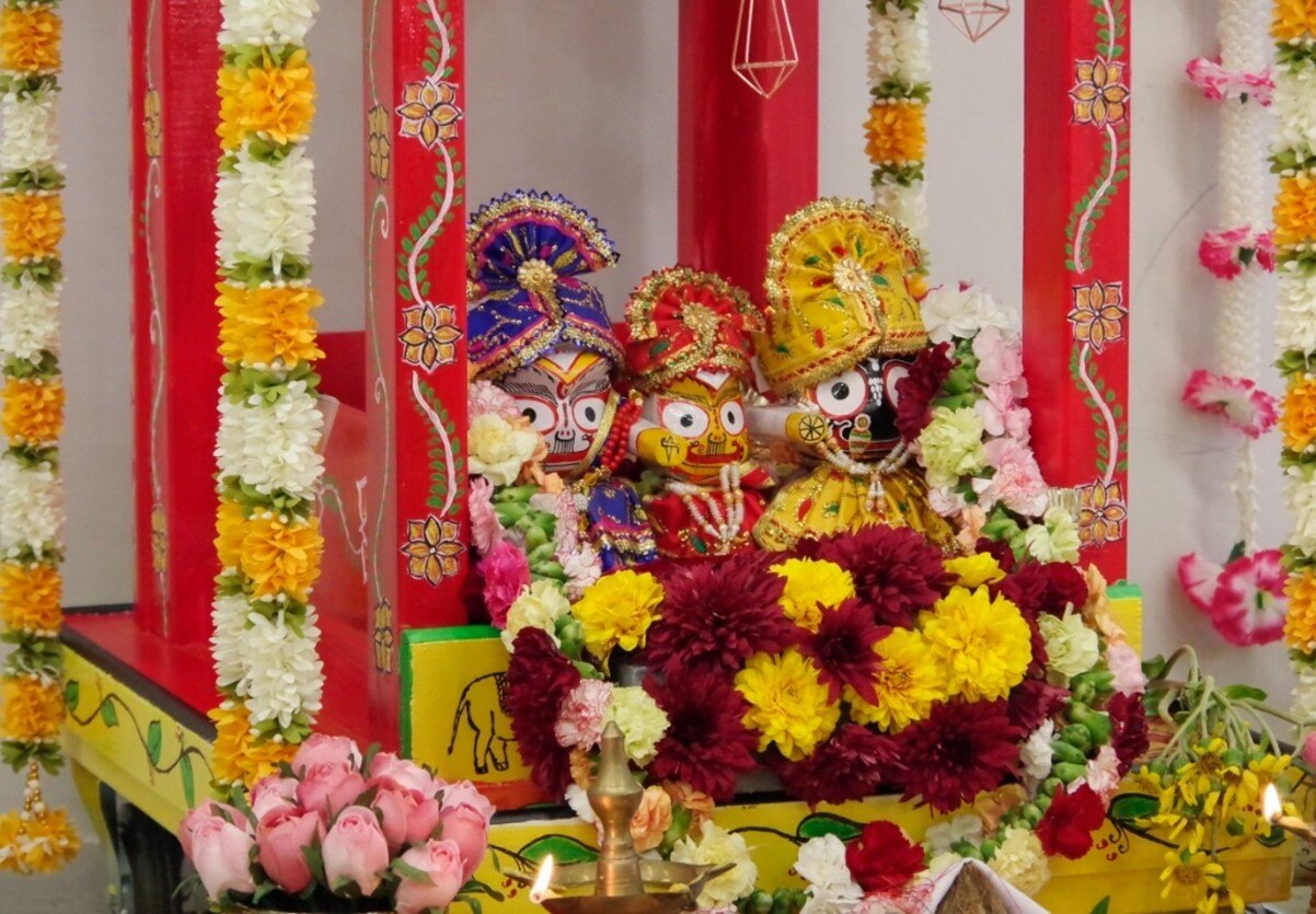 Figure 2 Idols of Lord Jagannath with his elder brother - Balabhadra, and their sister- Subhadra at celebration in Auckland.