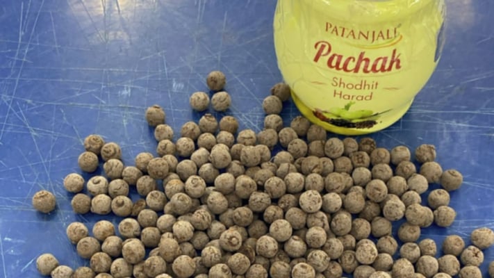 Images released by Police appear to show a container labelled as Patanjali Pachak with tablets placed next to it.