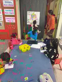 Photo 3_Teacher guiding children to know their places of birth