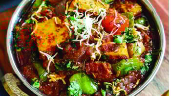 Cottage Cheese, Cooked With Whole Red Chillies In Tomato Based Gravy