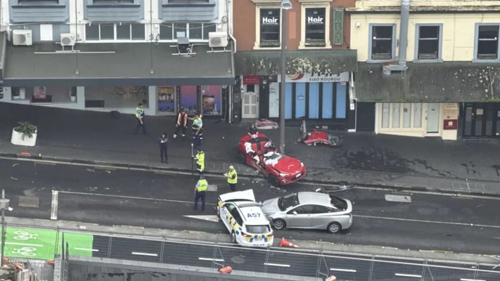 Car speeds through Akl street, nearly hits woman before collision