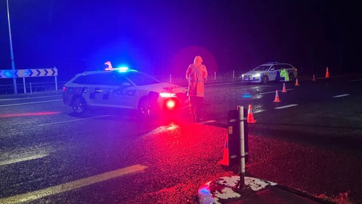 Police at the scene of what they say was a head-on collision.