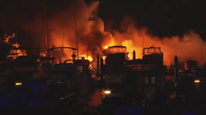 Fire rips through mosman marina, sinking superyachts