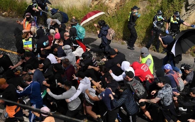 Nearly 300 arrested and10 police officers injured in Australia lockdown protests
