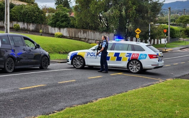 Man dead after shots fired at police near West Auckland school