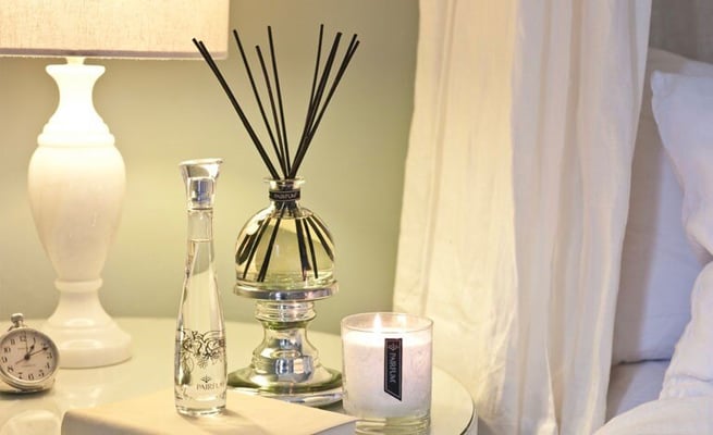 Discover the enchanting aura of scented candles and reed diffusers